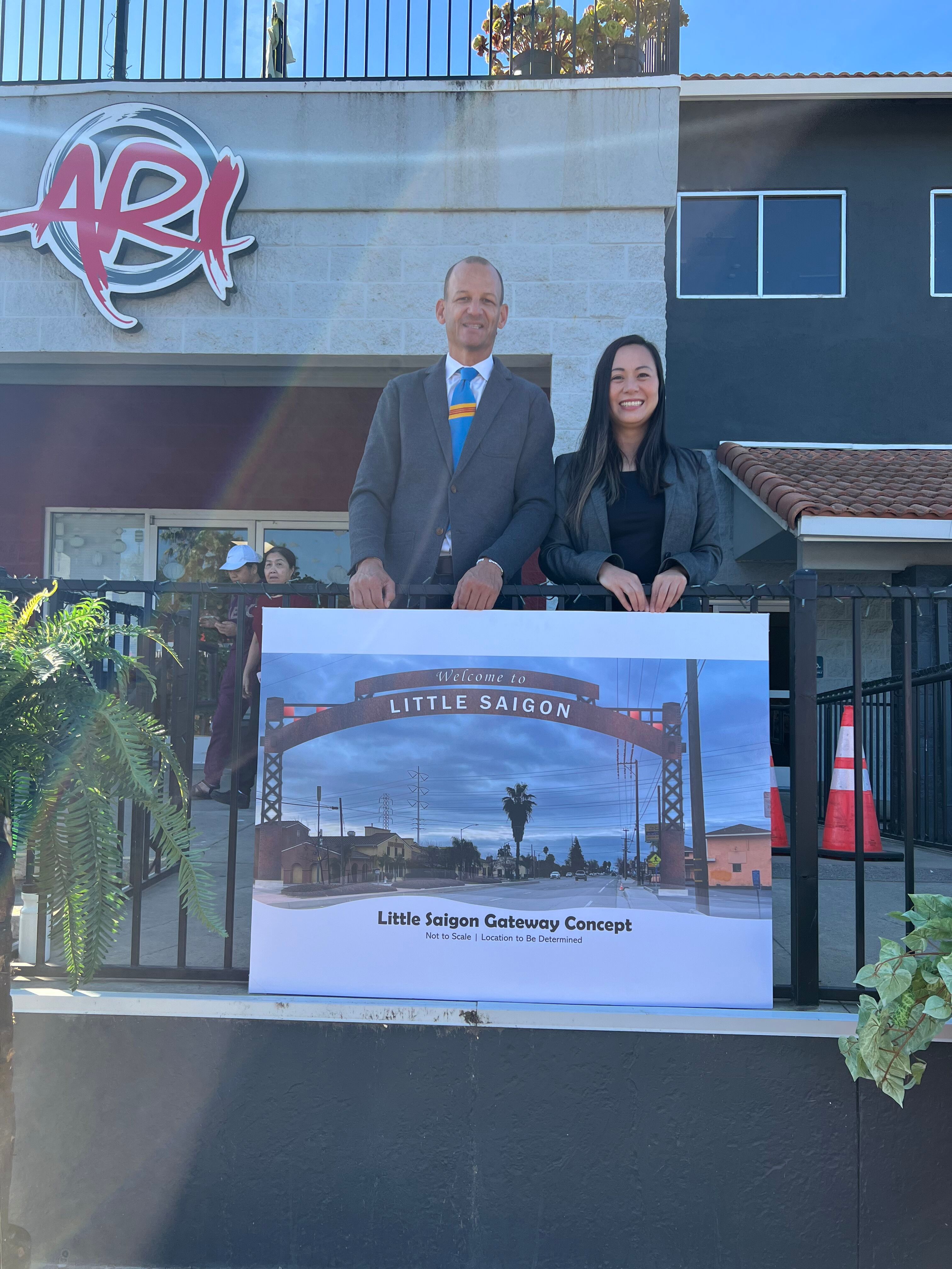 Asm. McCarty and Asm. Nguyen presenting a possible rendering for the Little Saigon Archway Project.