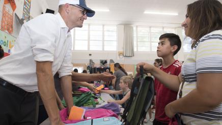 Assemblymember McCarty passes out backpacks